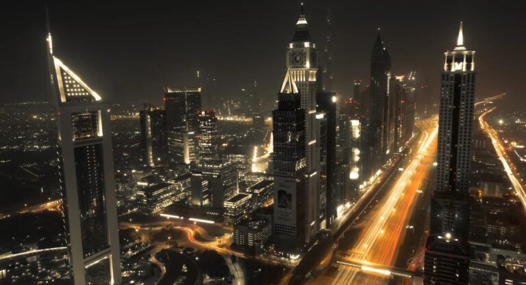 Dubai skyline at night with illuminated towers along Sheikh Zayed Road