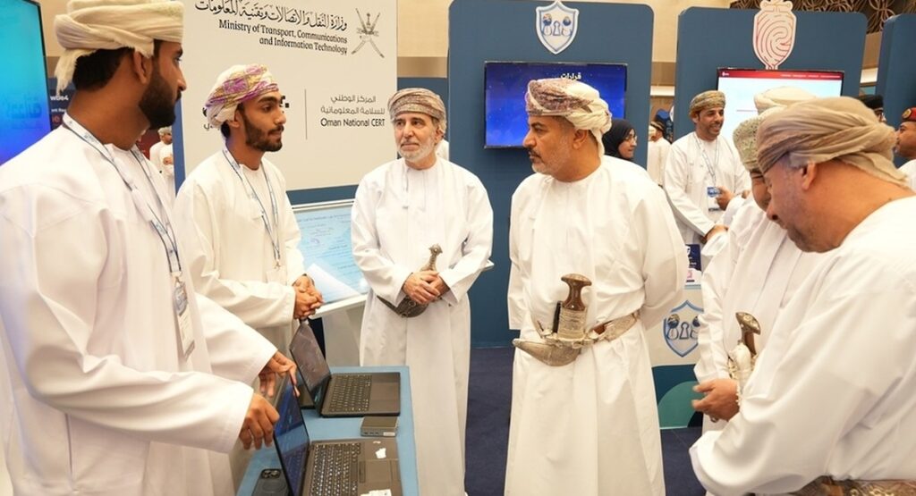 Officials tour a startup booth at the Hadatha Cybersecurity Industry Exhibition in Muscat