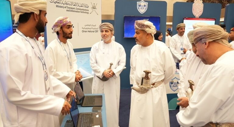 Officials tour a startup booth at the Hadatha Cybersecurity Industry Exhibition in Muscat