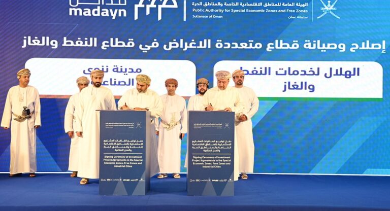 Officials signing investment agreements in Oman under OPAZ and Madayn banners