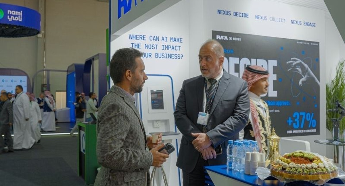 Conversation at the Raya Nexus booth during Money20/20 Middle East